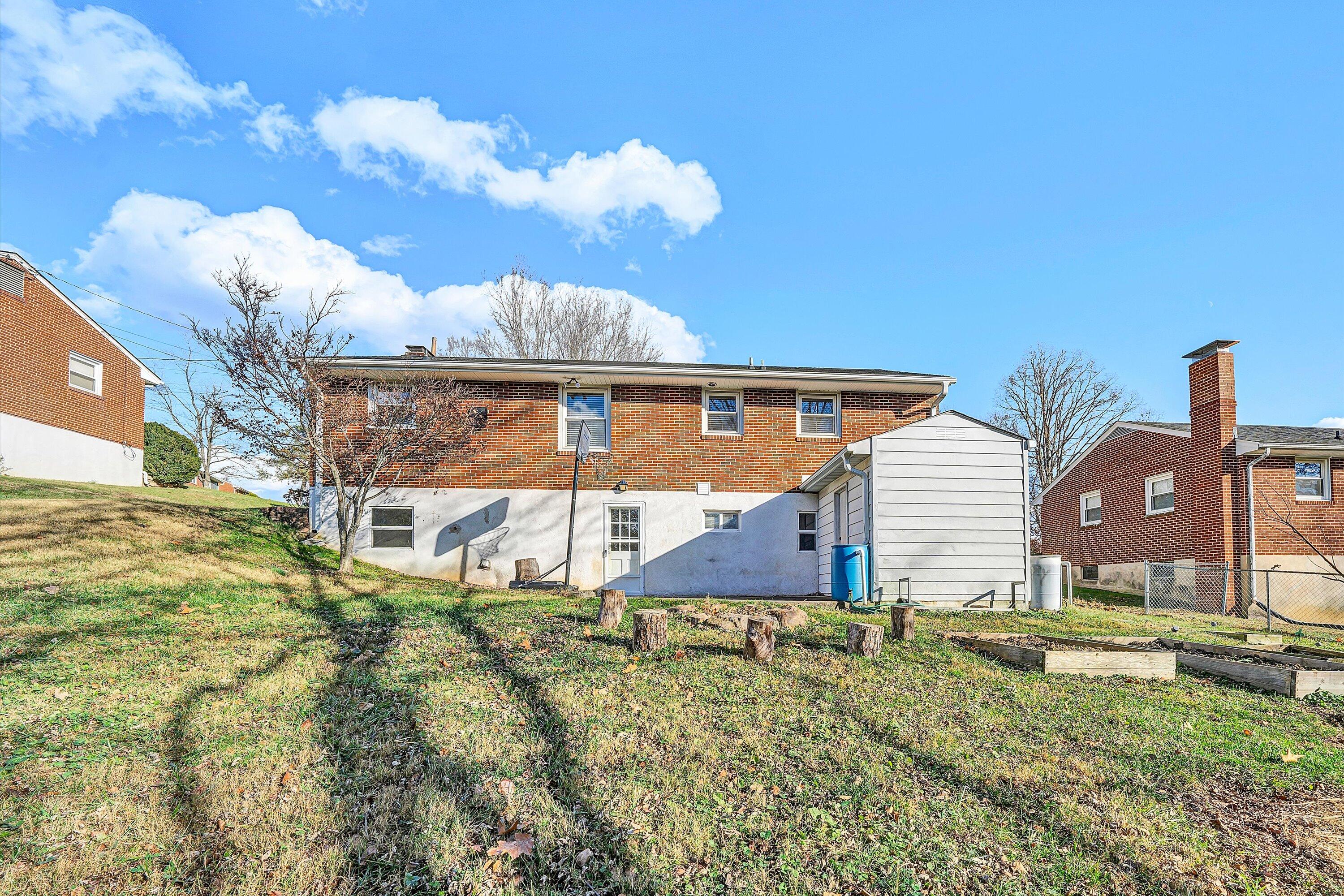 519 Doyle Street Salem, VA 24153 - Photo 37 of 40 a backyard of a house with table and chairs