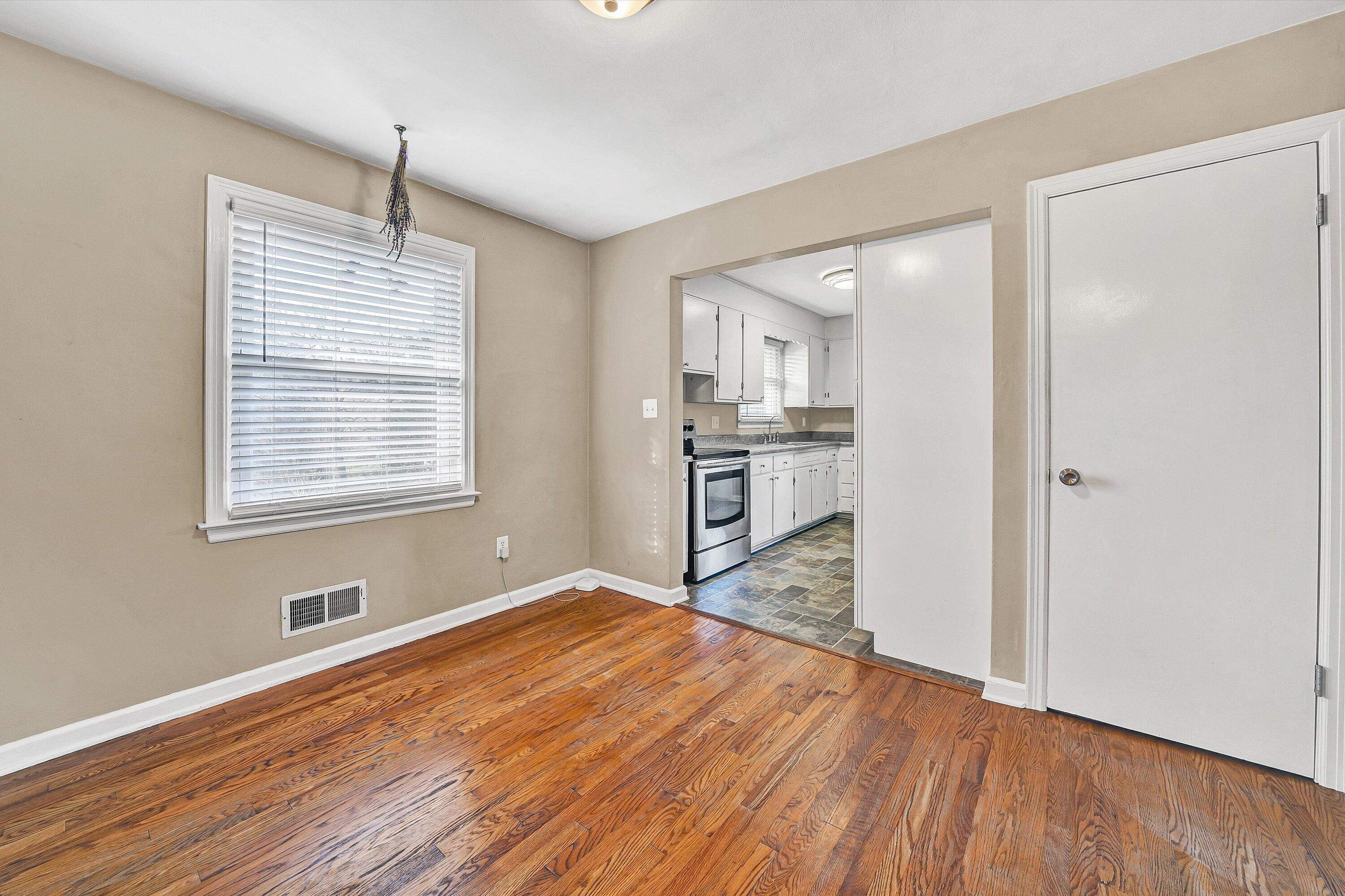 519 Doyle Street Salem, VA 24153 - Photo 9 of 40 a view of a kitchen with wooden floor electronic appliances and windows