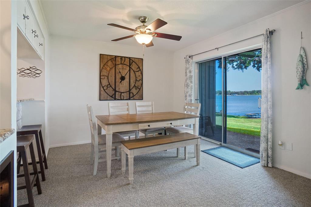 388 Driftwood Court, Unit 1A Azle, TX 76020 - Photo 7 of 29 Sliding doors for a view form kitchen and dinning table