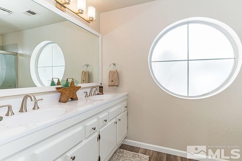 530 Tarn Way Reno, NV 89503 - Photo 13 of 25 a bathroom with a sink and a mirror