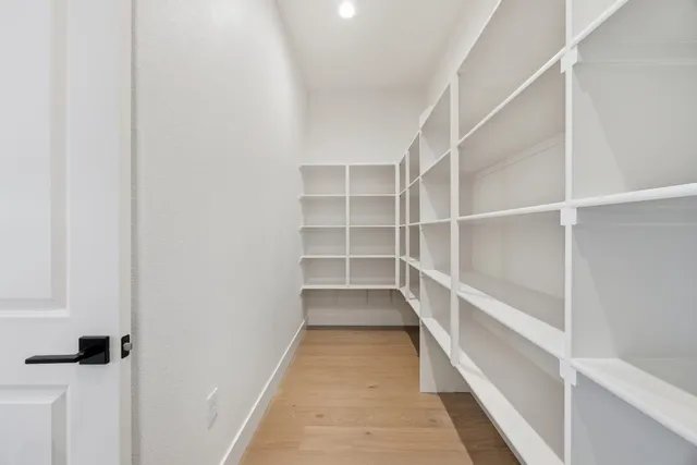a bathroom with a sink toilet and a mirror