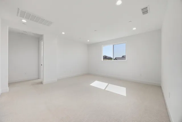 a view of a room with white walls