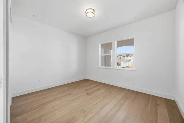 a bathroom with a shower sink mirror and toilet