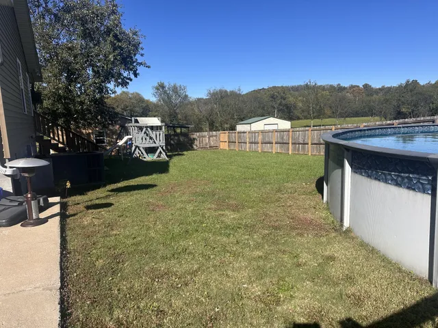 a view of outdoor space and yard