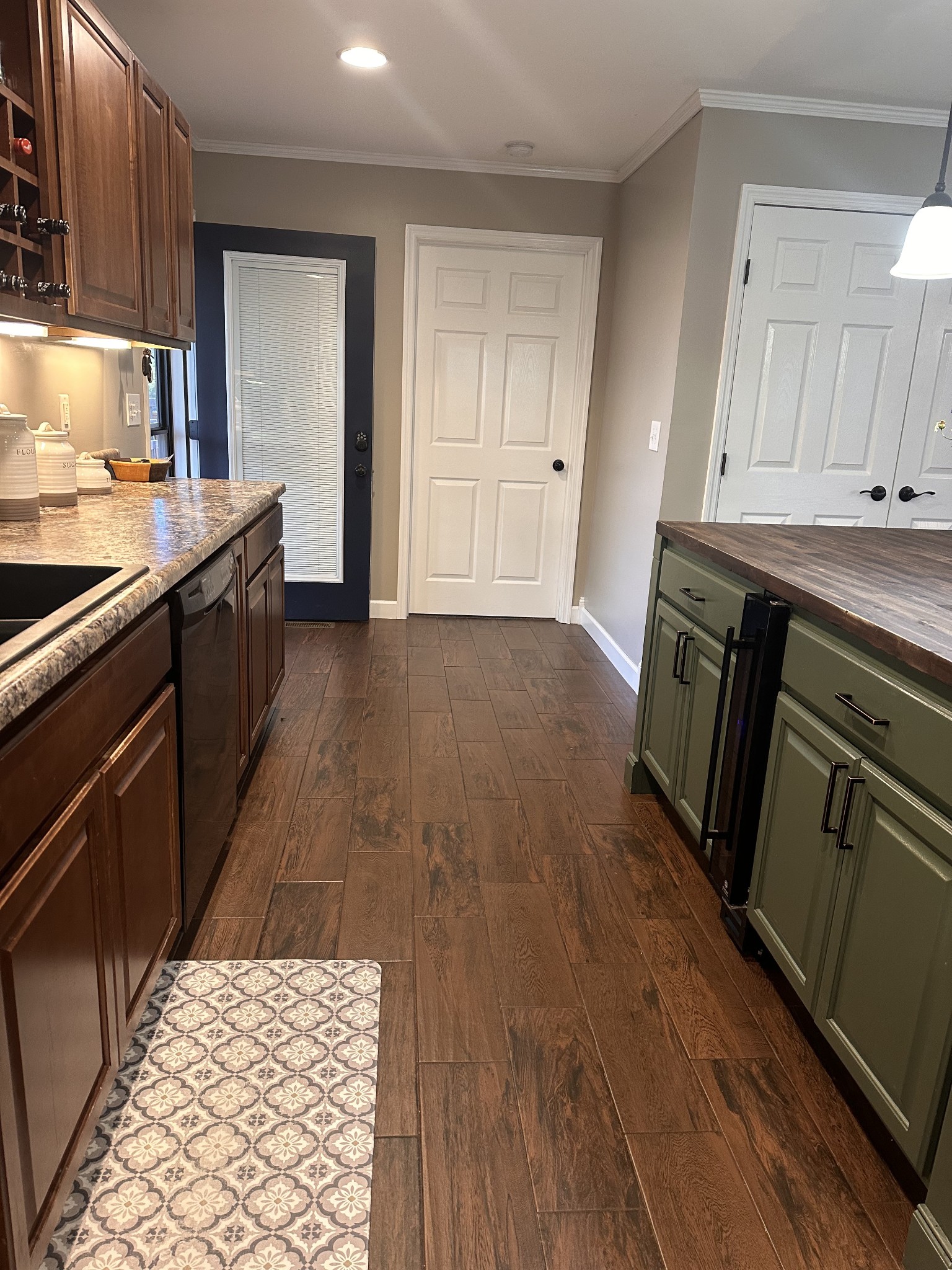 2491 Lassiter Road Readyville, TN 37149 - Photo 14 of 36 a kitchen with a sink and wooden floor