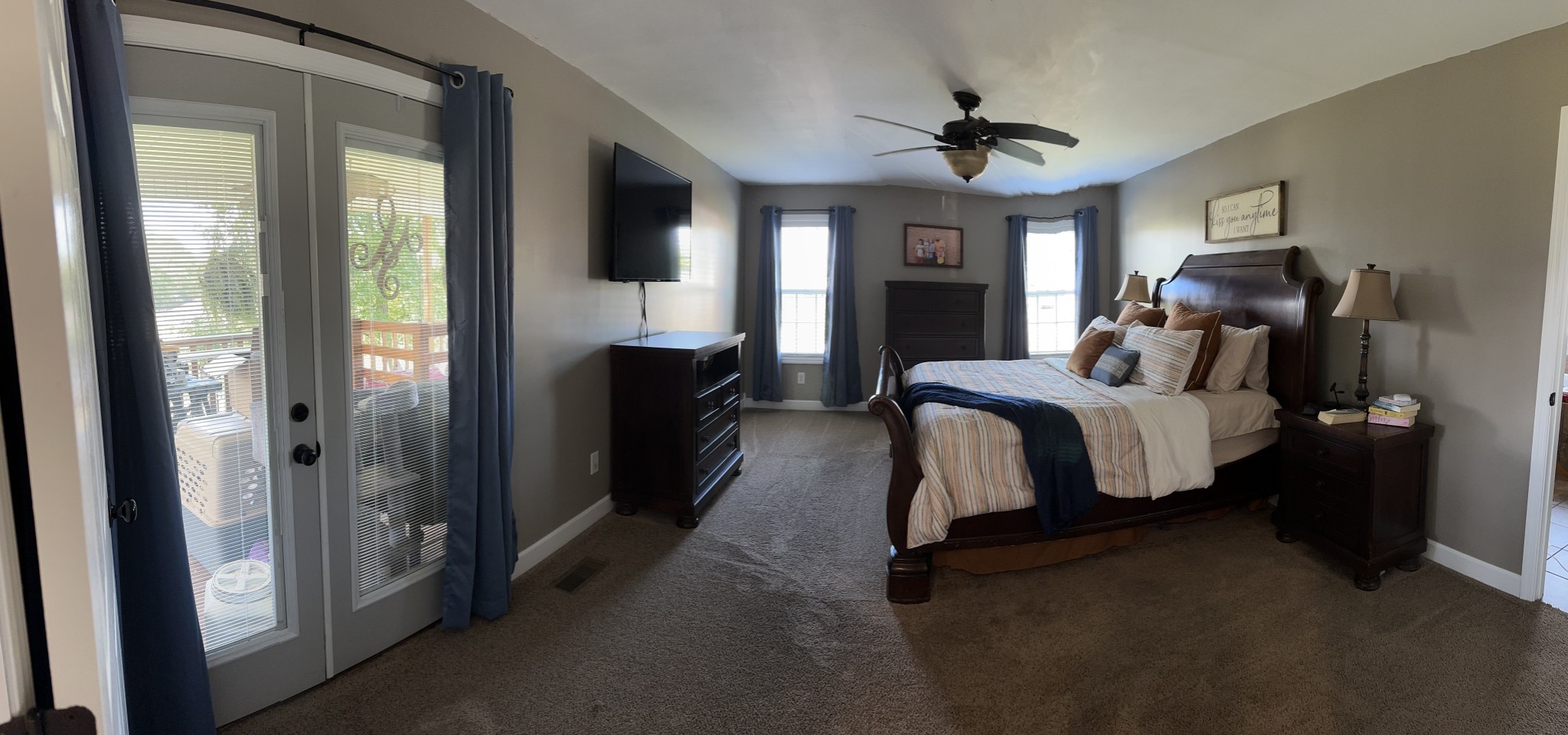 2491 Lassiter Road Readyville, TN 37149 - Photo 19 of 36 a bed room with a bed and a chandelier