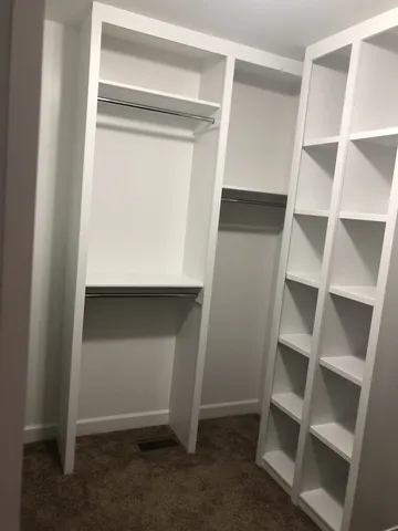 a view of an empty walk in closet