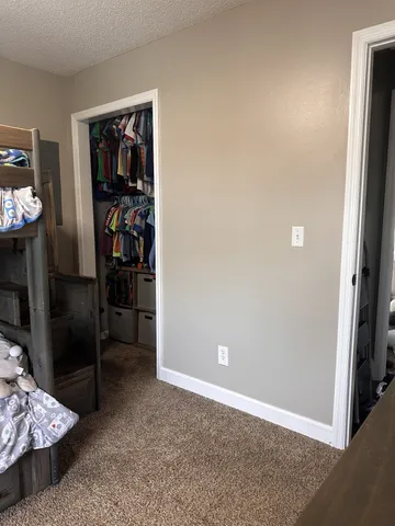 a view of livingroom with furniture and a flat screen tv