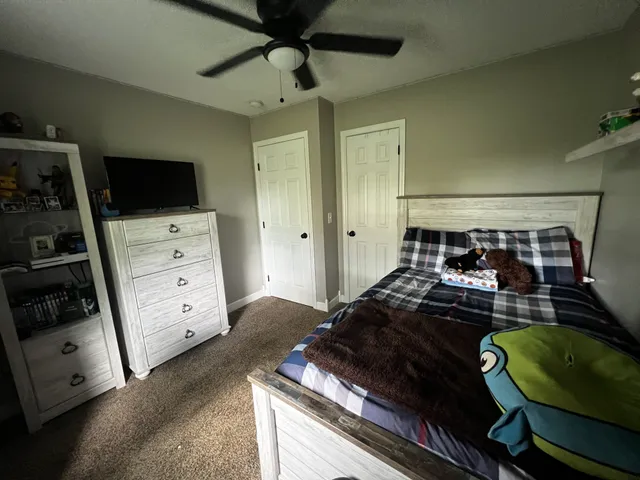 a bedroom with a bed and furniture