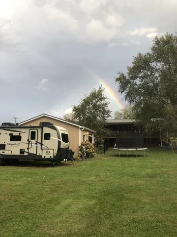 a view of a house with a big yard