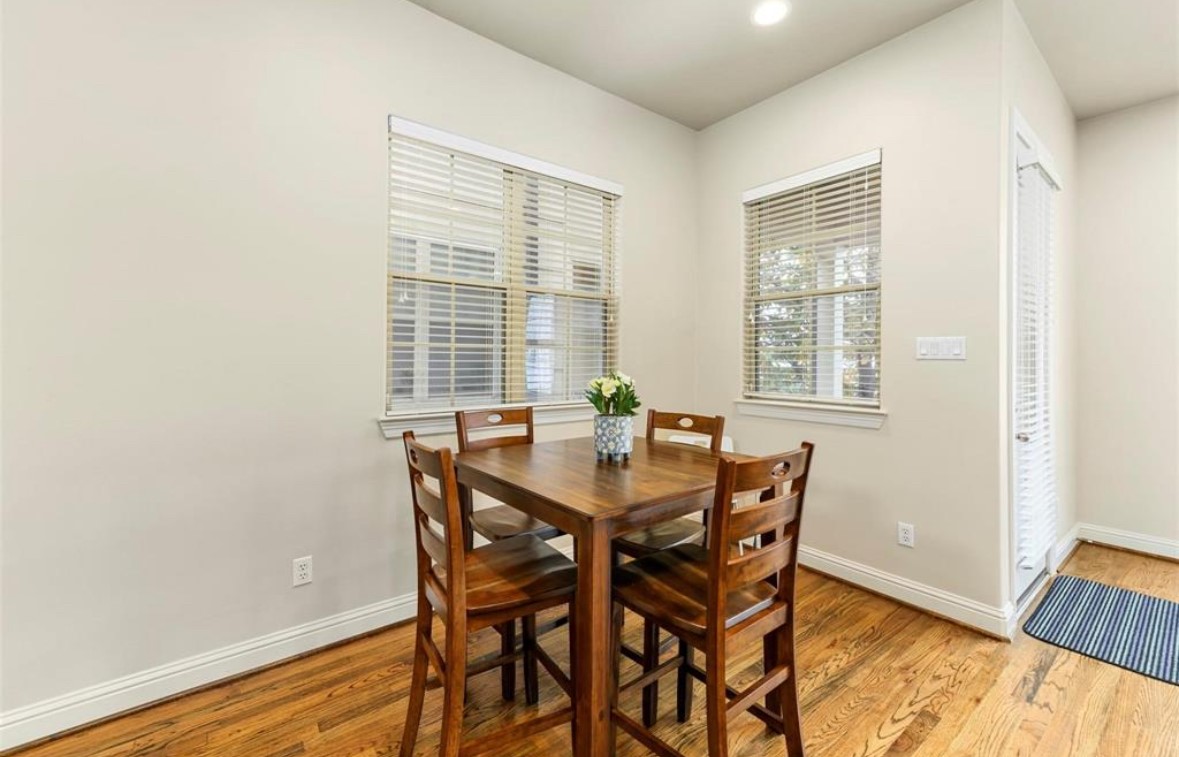 1215 Roberts Street Houston, TX 77003 - Photo 12 of 20 a view of a dining room with furniture and wooden floor