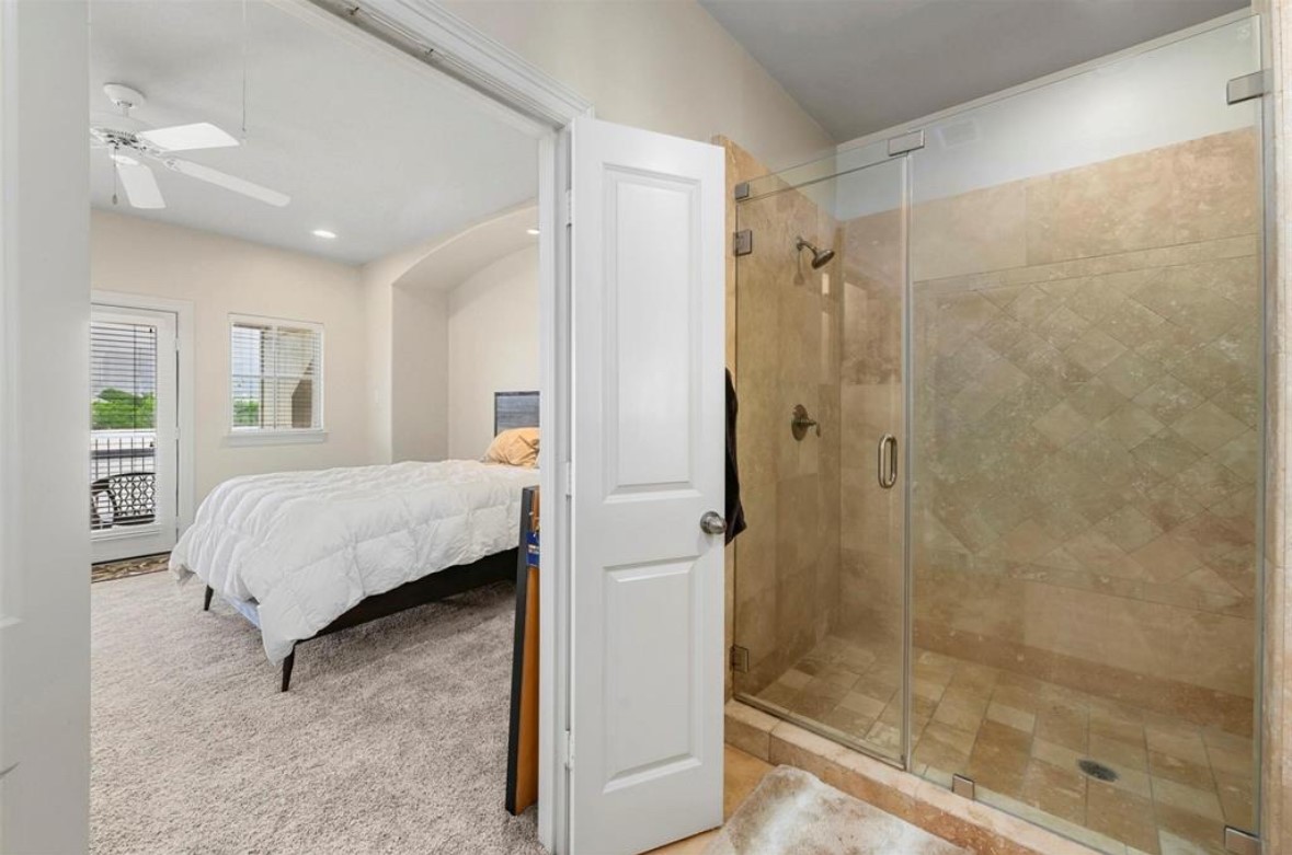 1215 Roberts Street Houston, TX 77003 - Photo 9 of 20 a bedroom with a bed and a shower