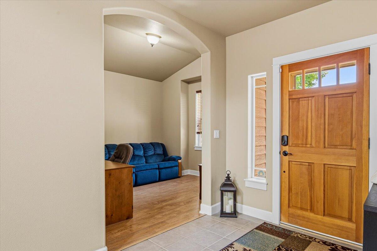 1339 Southwest Rimrock Way Redmond, OR 97756 - Photo 3 of 26 a view of a livingroom with furniture and a window