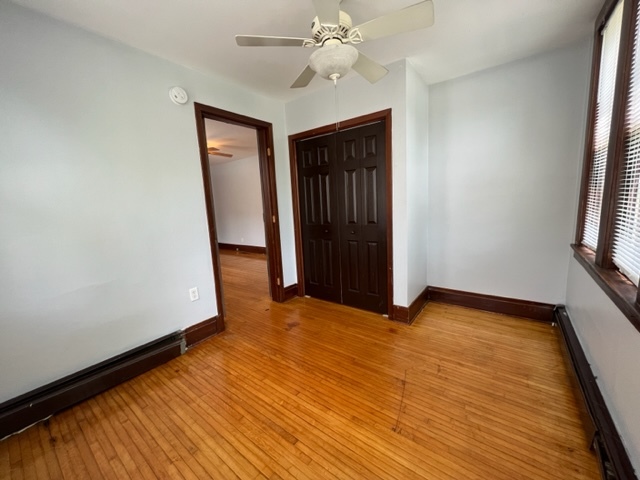 532 South Street Elgin, IL 60123 - Photo 11 of 43 wooden floor in an empty room with a window