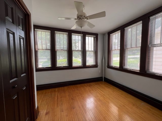 532 South Street Elgin, IL 60123 - Photo 12 of 43 a view of an empty room with a window and wooden floor