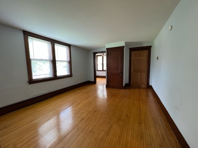 532 South Street Elgin, IL 60123 - Photo 15 of 43 a view of an empty room with wooden floor and window