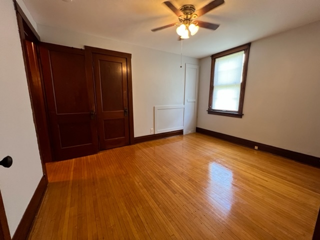 532 South Street Elgin, IL 60123 - Photo 16 of 43 a view of an empty room with wooden floor and a window