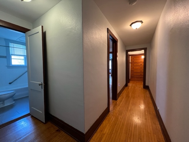 532 South Street Elgin, IL 60123 - Photo 17 of 43 a view of a hallway with wooden floor and closet