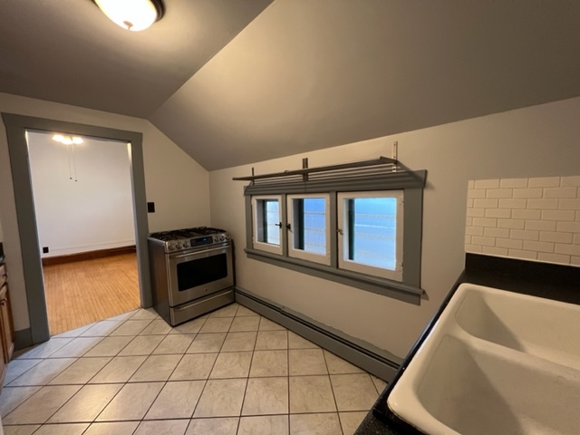 532 South Street Elgin, IL 60123 - Photo 26 of 43 a kitchen with stainless steel appliances a stove a sink and a refrigerator