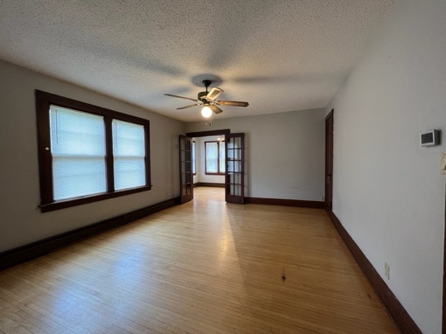 532 South Street Elgin, IL 60123 - Photo 34 of 43 a view of an empty room with window and wooden floor