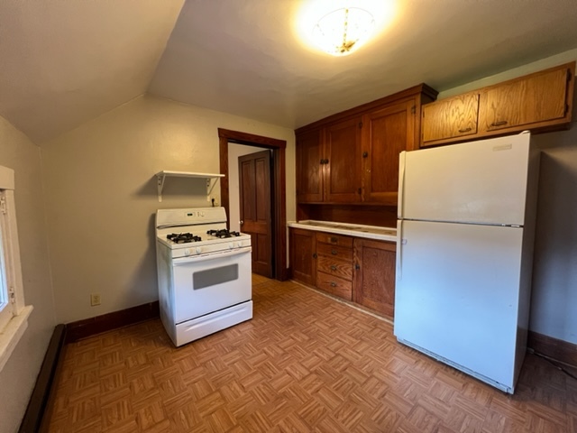532 South Street Elgin, IL 60123 - Photo 36 of 43 a kitchen with a refrigerator and a stove
