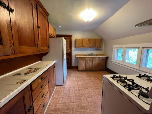 532 South Street Elgin, IL 60123 - Photo 37 of 43 a kitchen with stainless steel appliances a stove a sink and a refrigerator