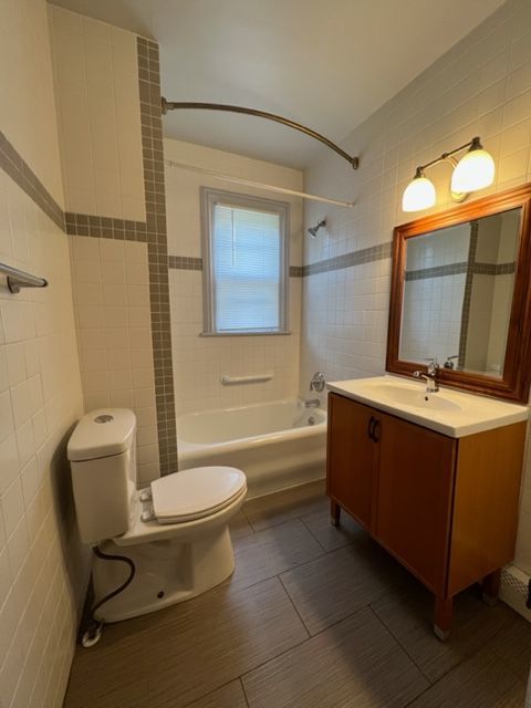 532 South Street Elgin, IL 60123 - Photo 40 of 43 a bathroom with a sink mirror vanity and toilet