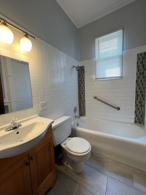 532 South Street Elgin, IL 60123 - Photo 6 of 43 a bathroom with a sink a toilet and shower