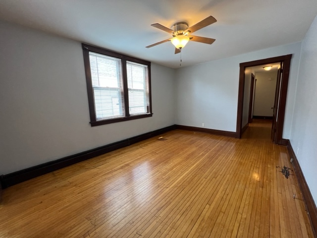 532 South Street Elgin, IL 60123 - Photo 10 of 43 an empty room with wooden floor and windows