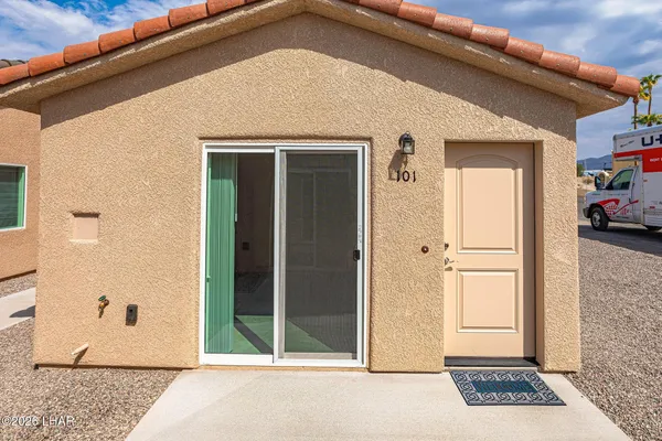 a view of a door and a window
