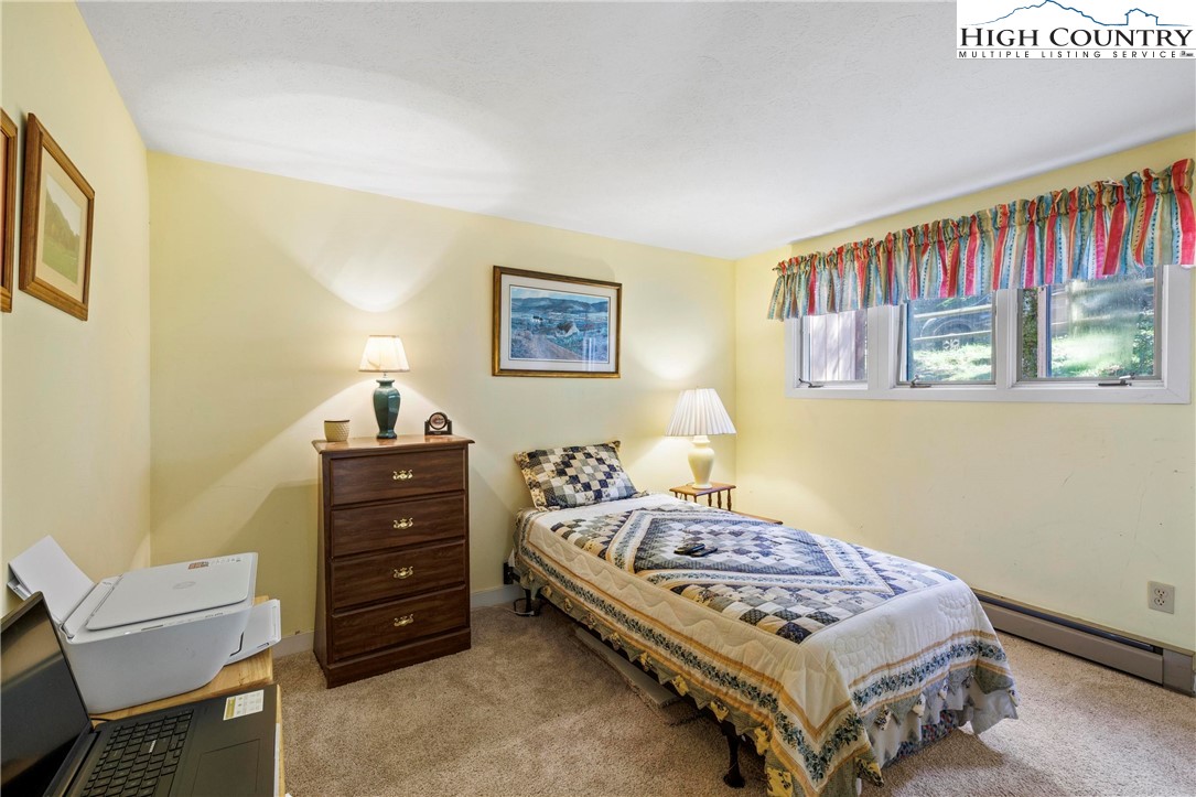 108 Northridge Road, Unit 3A Beech Mountain, NC 28604 - Photo 19 of 23 a bedroom with a bed and furniture