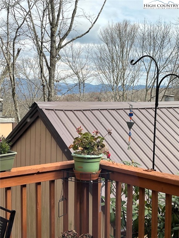 108 Northridge Road, Unit 3A Beech Mountain, NC 28604 - Photo 21 of 23 a view of a pathway of a house with wooden fence and floor