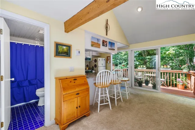 a bedroom with furniture and a window