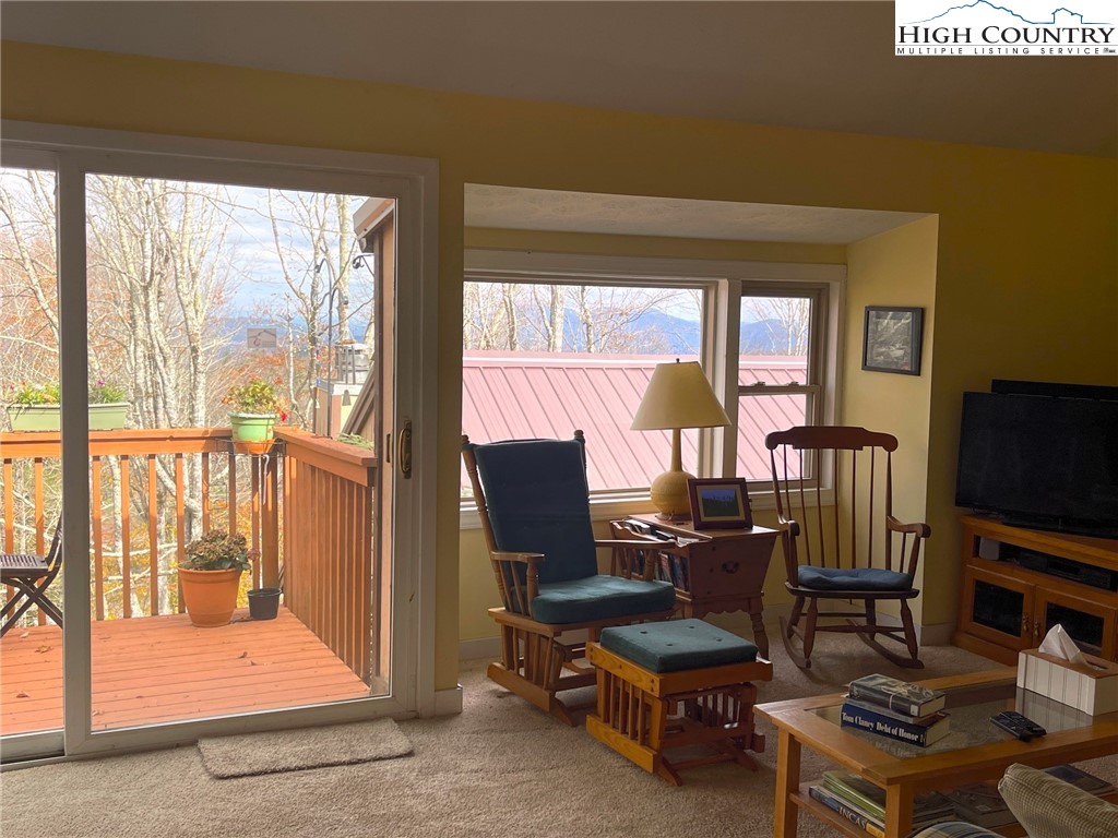 108 Northridge Road, Unit 3A Beech Mountain, NC 28604 - Photo 6 of 23 a view of a workspace with furniture and a window