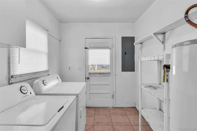 a kitchen with a refrigerator a stove top oven and cabinets