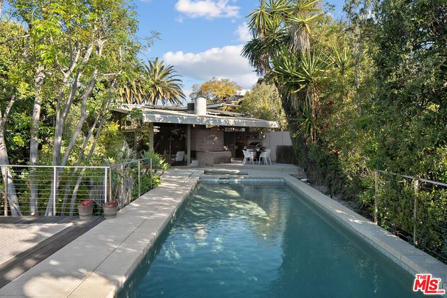 a view of a swimming pool with a patio