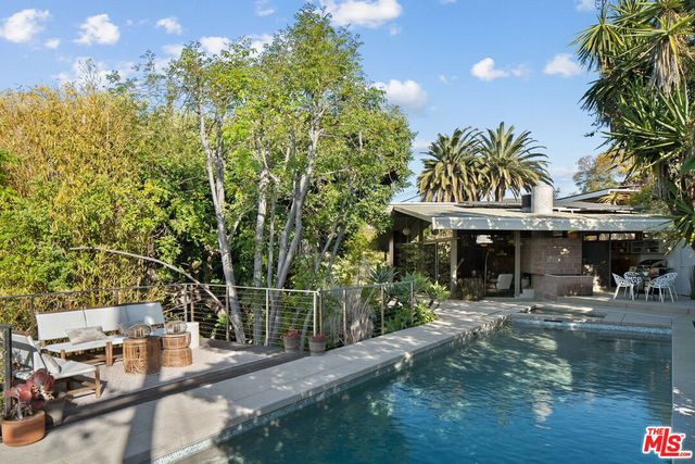 a view of a swimming pool with a patio