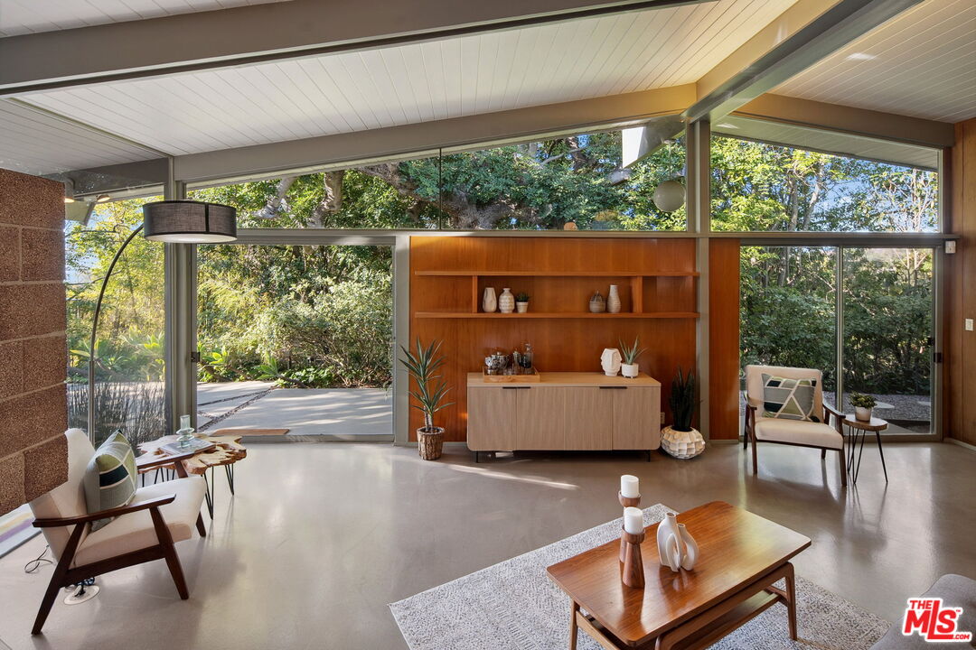 12412 Deerbrook Lane Los Angeles, CA 90049 - Photo 10 of 30 a room with furniture and a large window