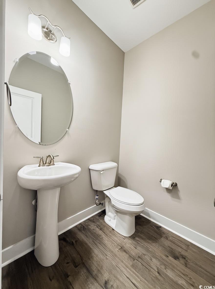 2108 Ballast Court Myrtle Beach, SC 29579 - Photo 17 of 37 Half bath featuring baseboards and dark wood-style floors