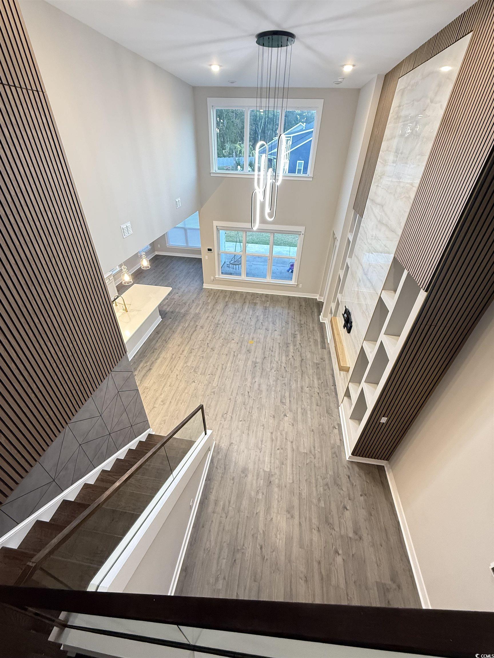2108 Ballast Court Myrtle Beach, SC 29579 - Photo 25 of 37 dining area featuring a towering ceiling, light wood-style floors, and recessed lighting