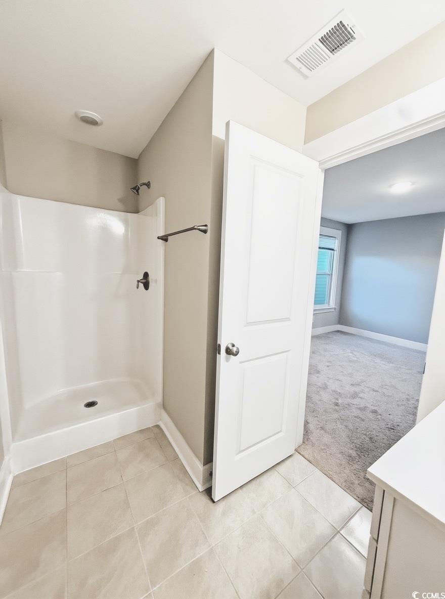 2108 Ballast Court Myrtle Beach, SC 29579 - Photo 28 of 37 Full bathroom featuring light tile patterned flooring, light colored carpet, a stall shower, and vanity