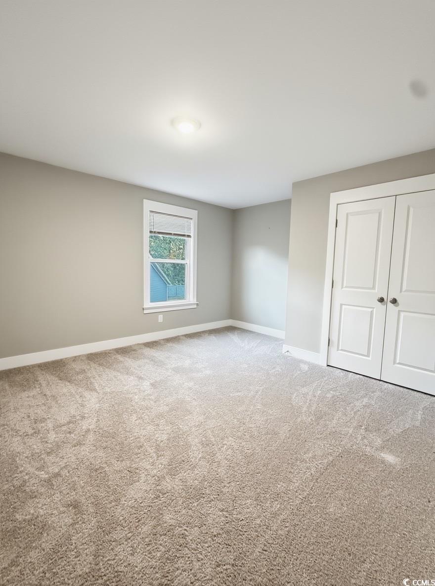 2108 Ballast Court Myrtle Beach, SC 29579 - Photo 30 of 37 Carpeted room with baseboards