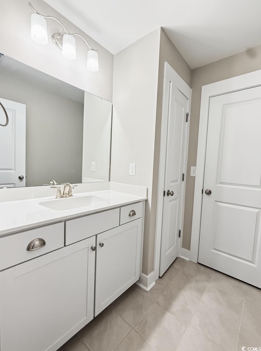 2108 Ballast Court Myrtle Beach, SC 29579 - Photo 32 of 37 Bathroom with vanity and light tile patterned floors