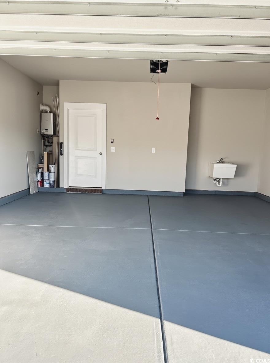 2108 Ballast Court Myrtle Beach, SC 29579 - Photo 35 of 37 Garage with baseboards and a garage door opener