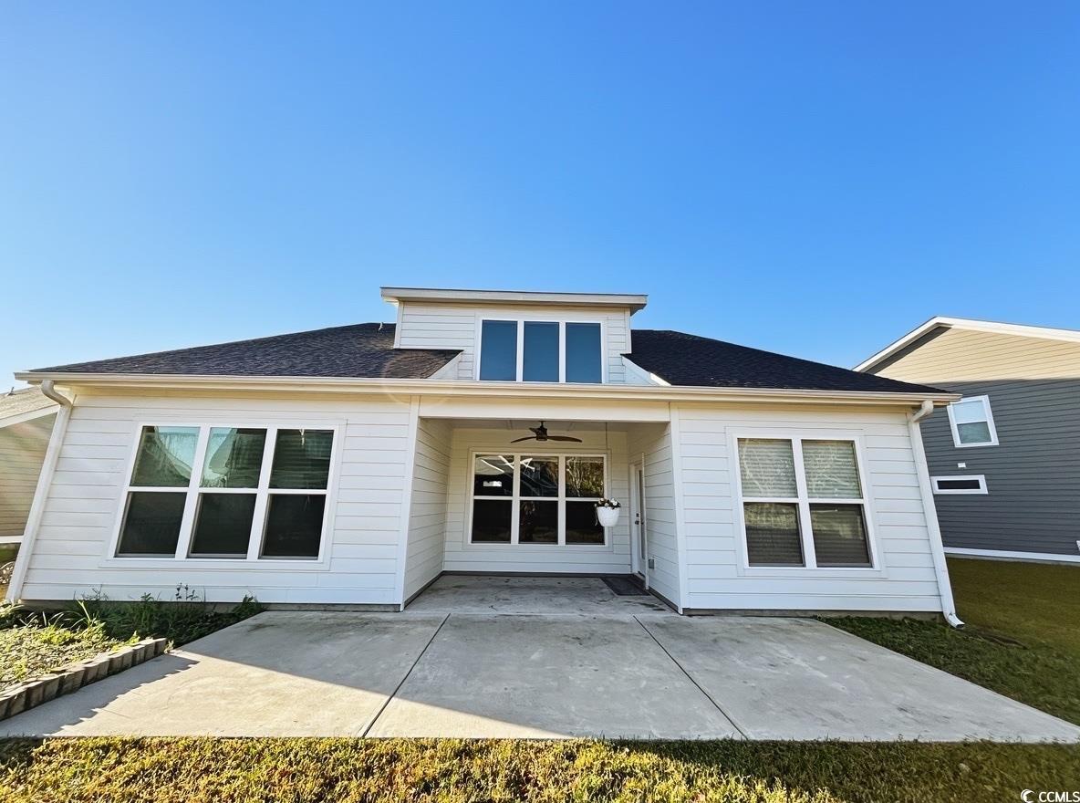 2108 Ballast Court Myrtle Beach, SC 29579 - Photo 36 of 37 Rear view of house with a patio area, ceiling fan, and a shingled roof