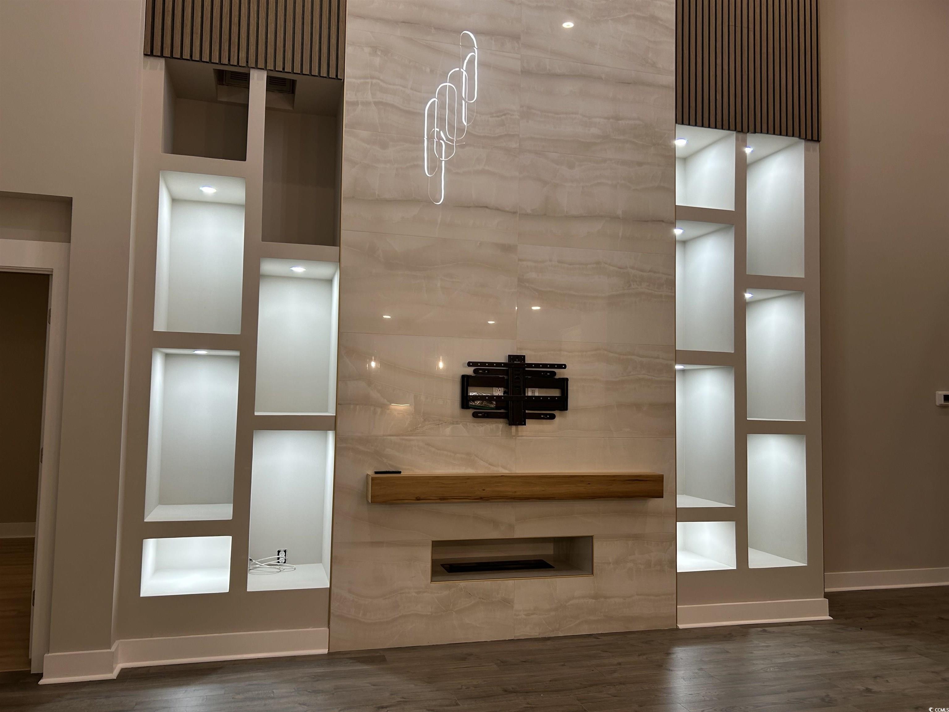 2108 Ballast Court Myrtle Beach, SC 29579 - Photo 4 of 37 Unfurnished living room featuring baseboards and dark wood-type flooring