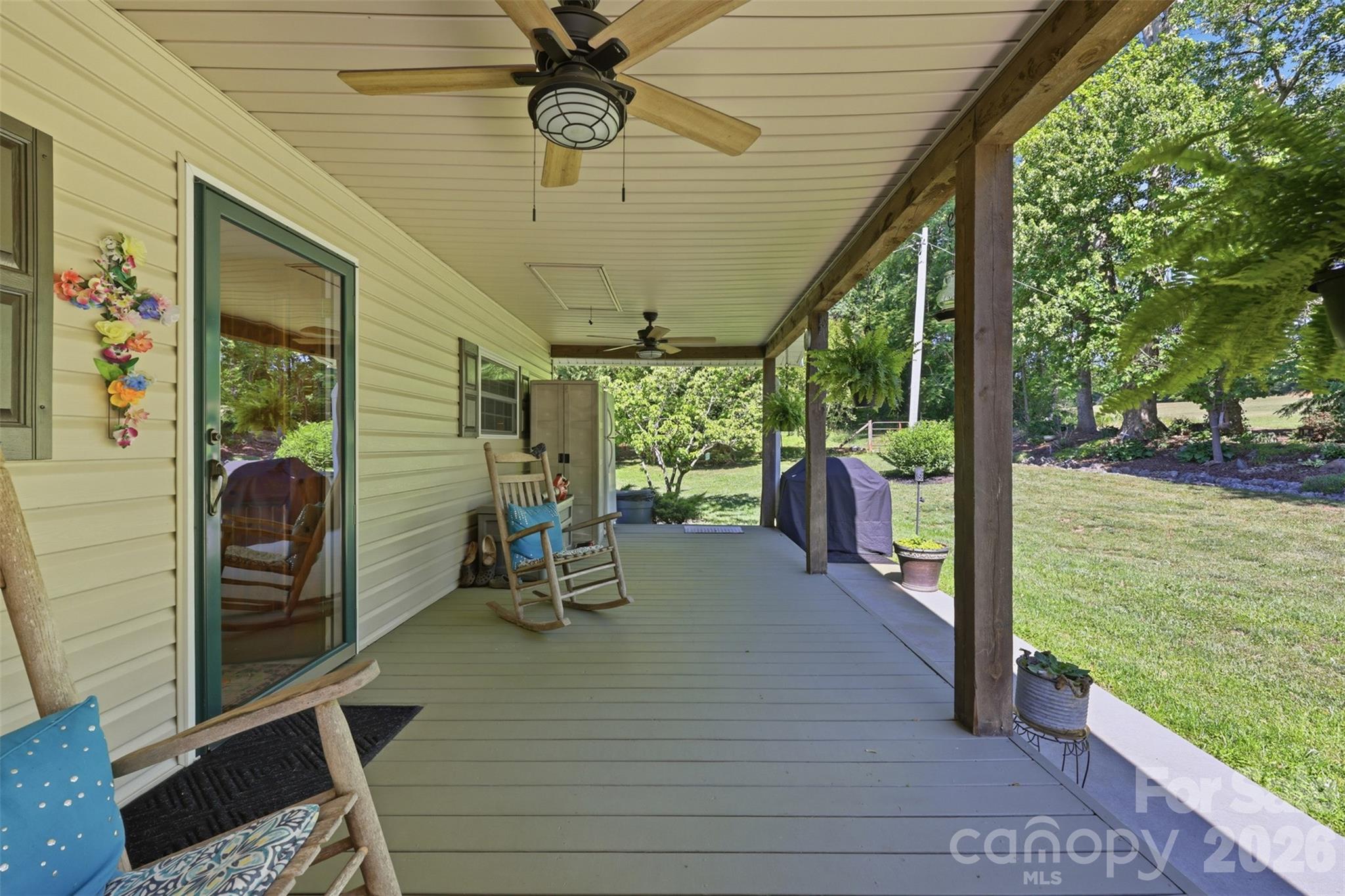 176-174 Oak Hollow Road Union Grove, NC 28689 - Photo 47 of 48 a view of a porch with chairs and backyard