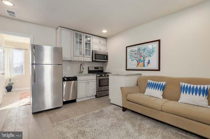 1720 H Street Northeast, Unit B Washington, DC 20002 - Photo 19 of 29 Modern kitchen in cozy living space.