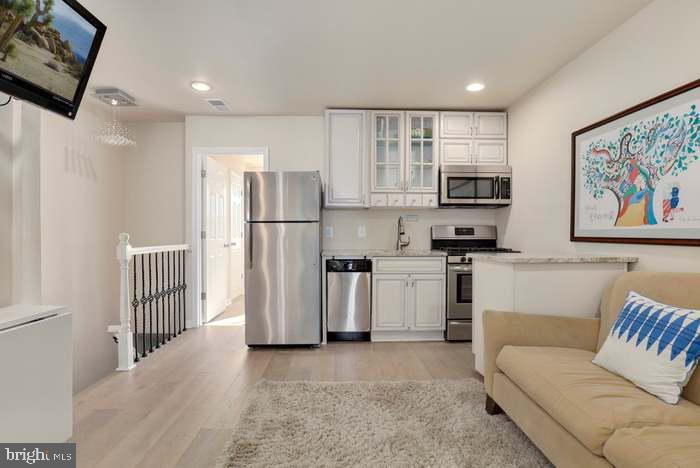 1720 H Street Northeast, Unit B Washington, DC 20002 - Photo 20 of 29 Modern kitchen in a cozy setting.