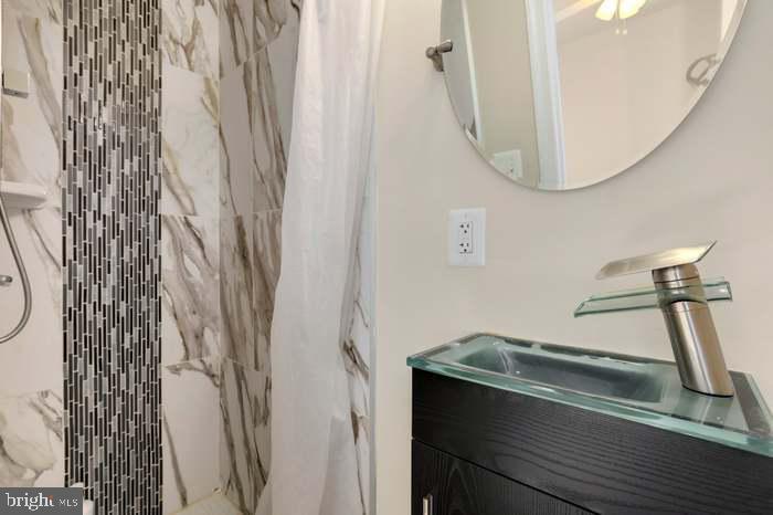 1720 H Street Northeast, Unit B Washington, DC 20002 - Photo 25 of 29 Sleek modern bathroom retreat.